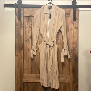 Khaki trench coat. Never worn. Tags on